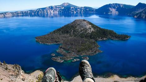 Taking a summer hiking break to admire Wizard Island in the pristine lake