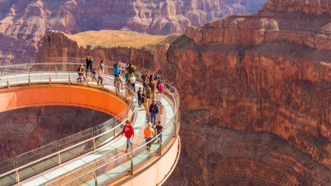 Visitors taking in the awesome views from the glass-bottomed Grand Canyon Skywalk