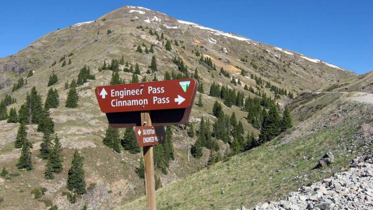 Directional signs for Alpine Loop trail explorers in the Lake City area