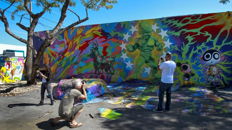 Snap photos of the vibrant colors and unique designs featured at Wynwood Walls 