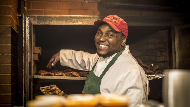 Getting ready to serve Charlie Vergos' world-famous pork