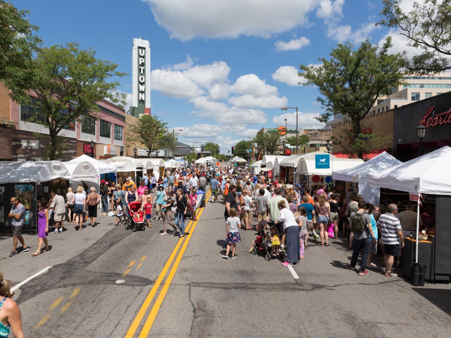 People browsing the booths at Uptown Art Fair