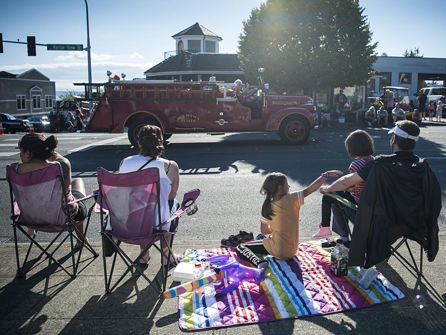 A fire truck rolls by during the parade at Waterland Festival