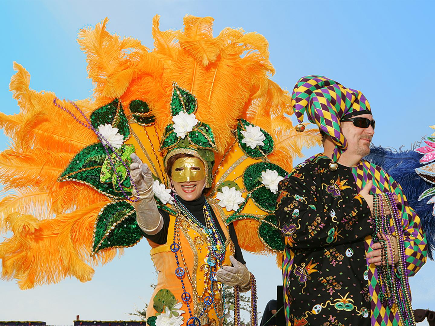 Throwing beads to the crowd during Lake Charles Mardi Gras