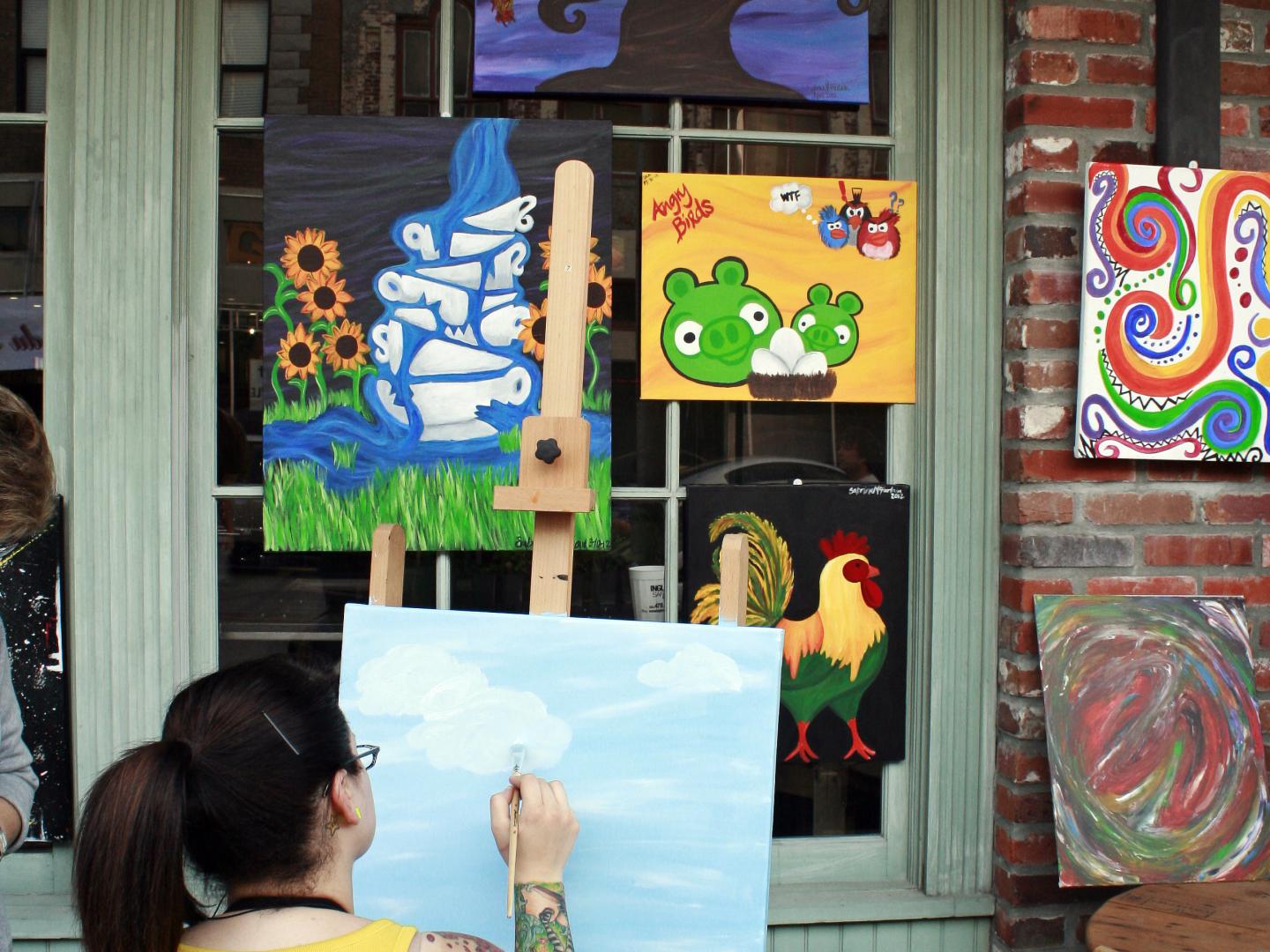 An artist at work during Lake Charles’ Spring Art Walk