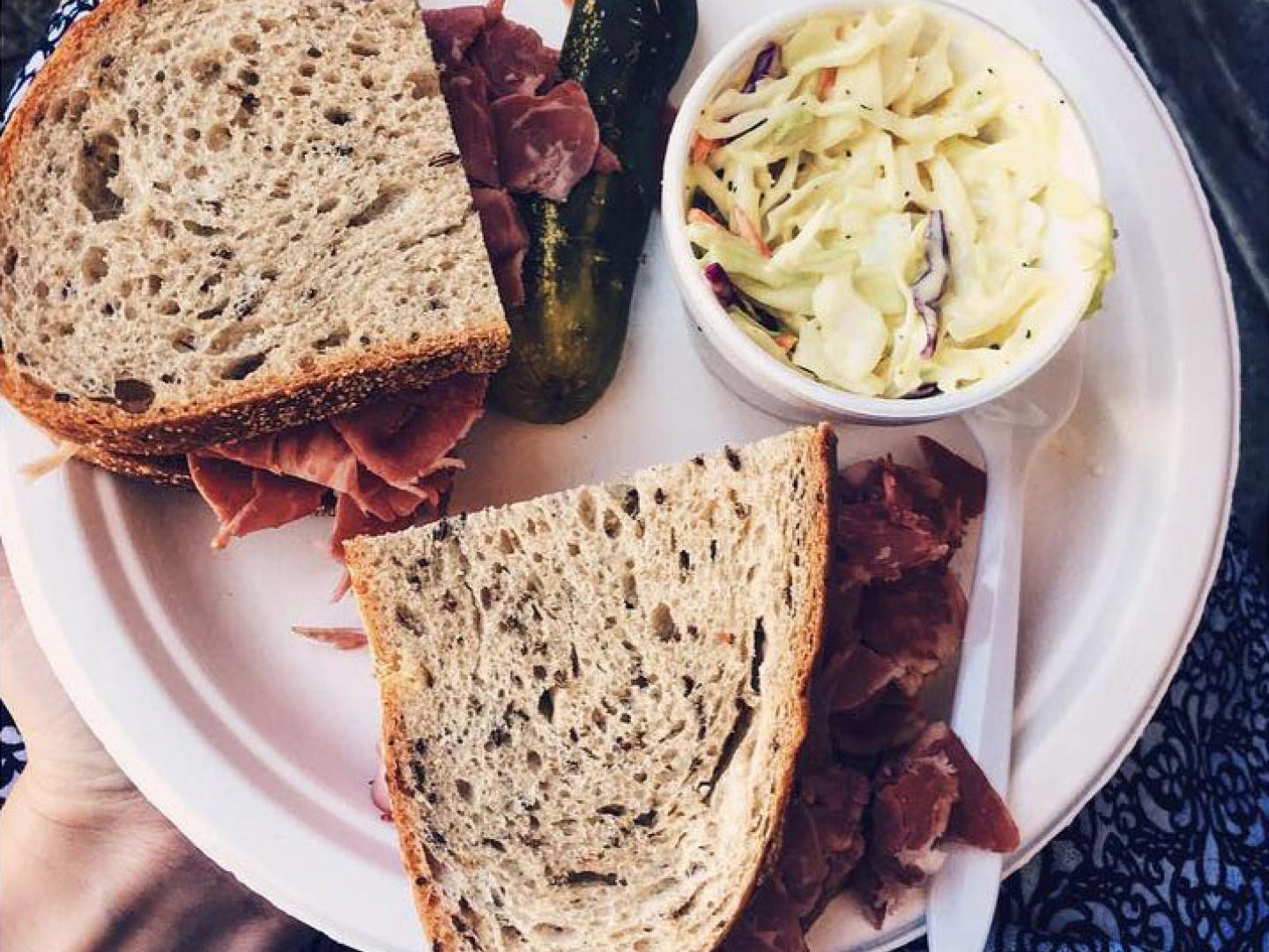 Sampling a sandwich during the Temple Israel Jewish Food Fair in Stockton, California