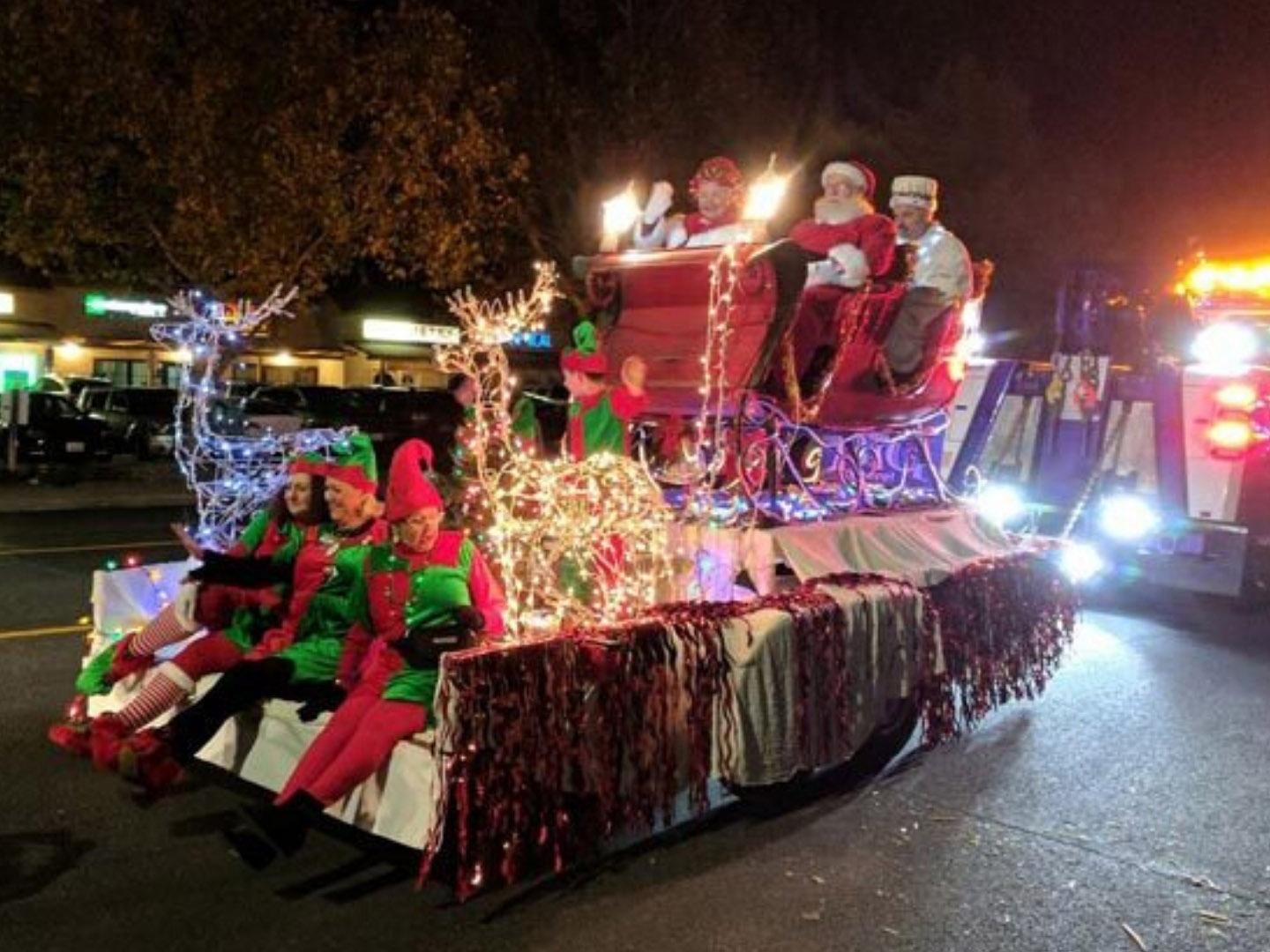 Float featuring Santa and Mrs. Claus during the Holiday Light Parade in Paso Robles, California