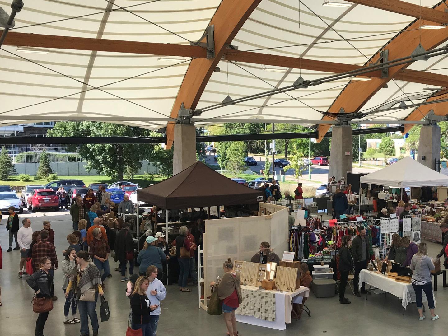 Patrons browsing booths during the St. Louis Park Art Fair at The ROC