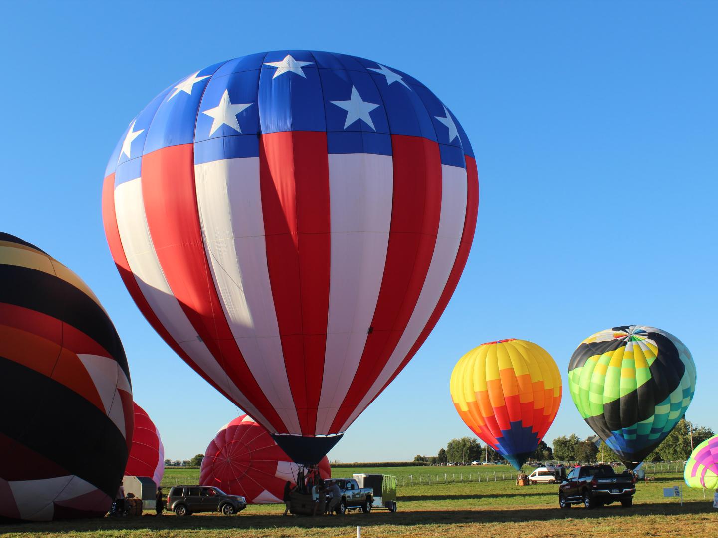 Hot air balloons prepare to launch from Bird-in-Hand, Pennsylvania, for the annual Lancaster Hot Air Balloon Festival