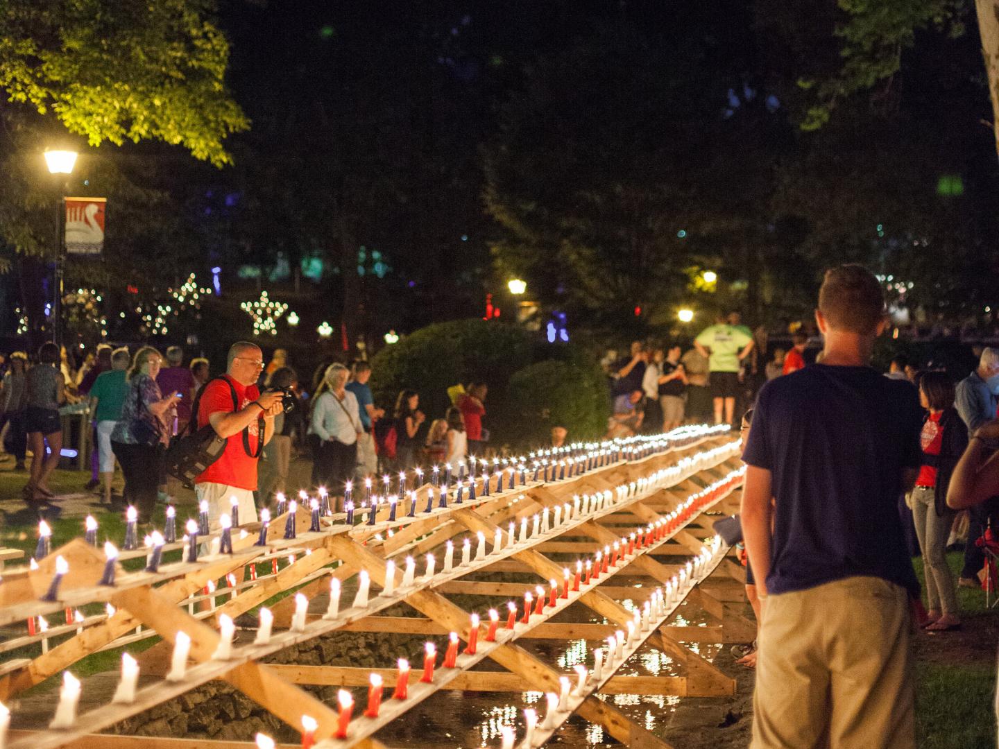 A sea of red, white and blue candles illuminates Lititz Springs Park during the Lititz Fourth of July Celebration