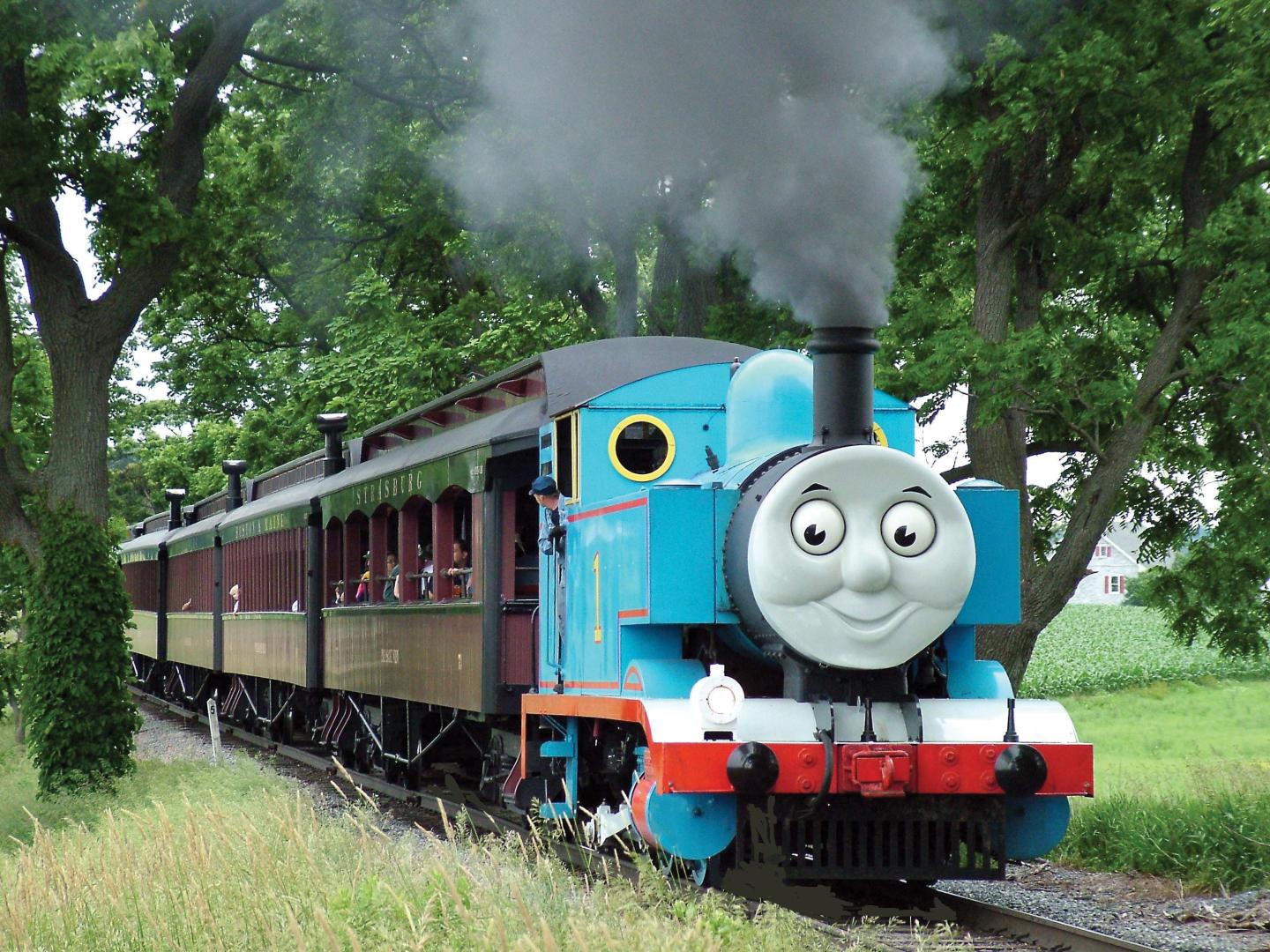 A train resembling Thomas the Tank Engine takes passengers along the Strasburg Rail Road 