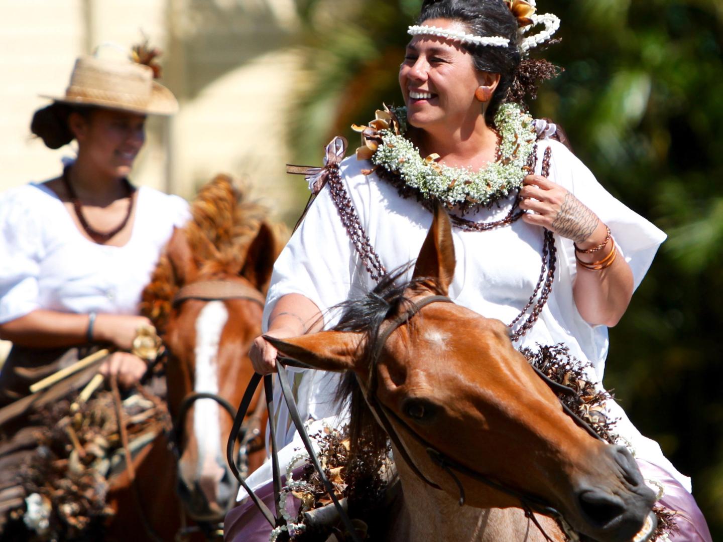 Pa'u riders on horseback during the Kamehameha Day Celebration Parade on Hawai’i Island