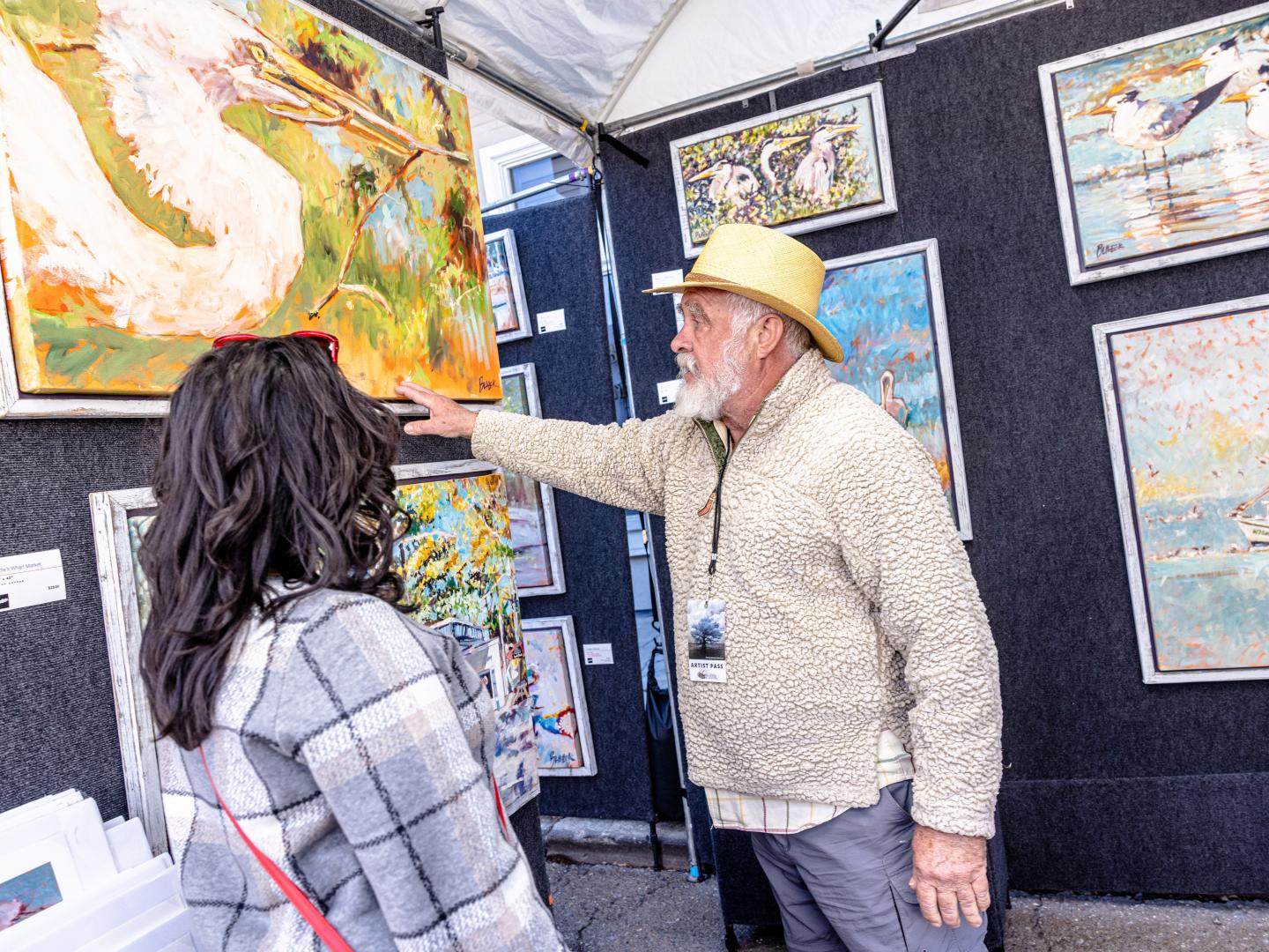 Admiring artwork at the Three Rivers Art Festival in Covington, Louisiana