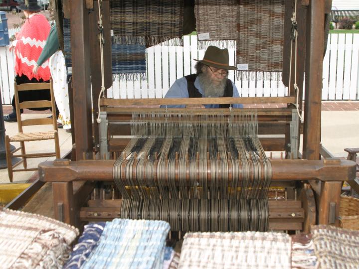 Working the loom at the Folklife Festival 