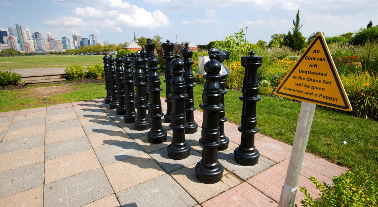 Outdoor giant chess game with the Manhattan backdrop at The Liberty House in Jersey City, New Jersey